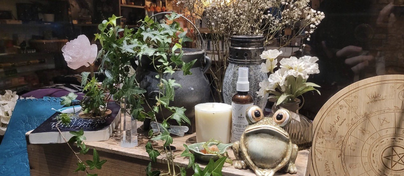 Owl candle and spell display inside The Wenlock Witch